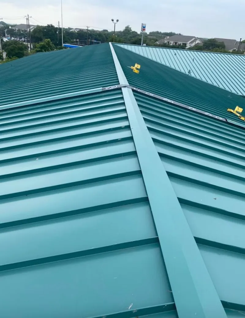 Green commercial metal roof ridge and valley for Metal Roof Repair in Kyle