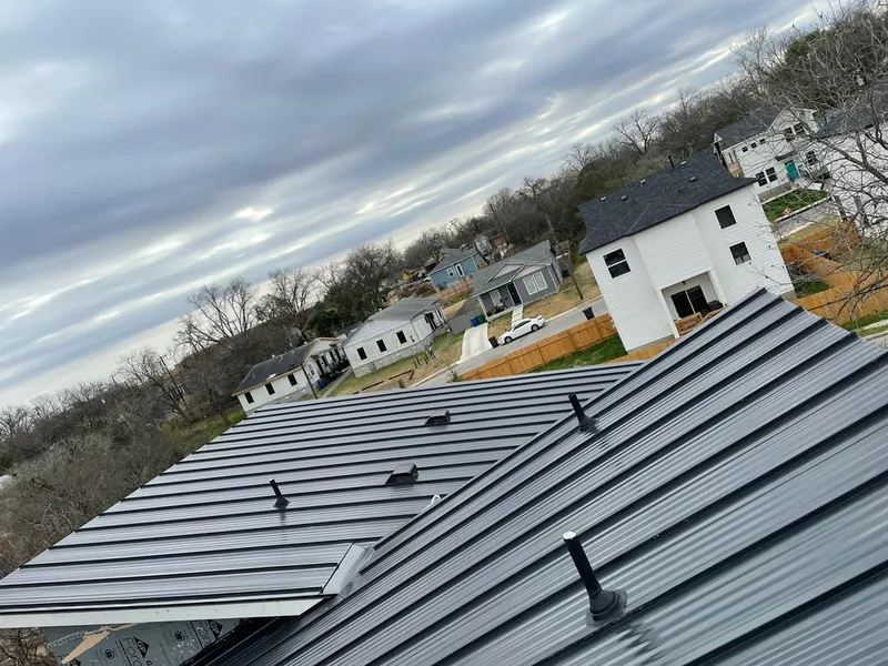 Standing seam metal roof panels with vents for Skylight Repair in Kyle